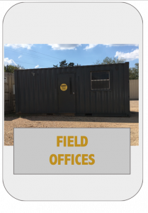 A field office with a black container and yellow sign.